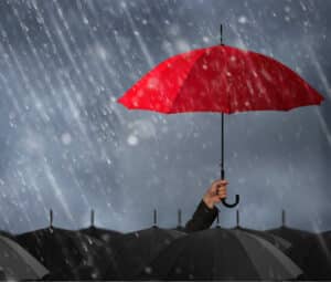 Holding an umbrella in the rain - an image of protecting all beings from suffering under the umbrella of the Buddha's activity