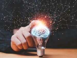 Man touching lightbulb, symbolizing the Buddhist science of mind